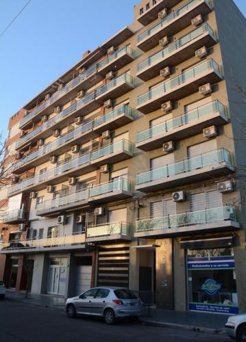 a building with a car parked in front of it at Aparts VC in Villa Constitución