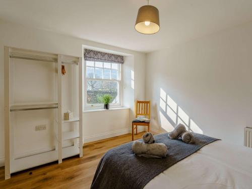 a bedroom with a bed with two teddy bears on it at 2 bed property in Keswick 86249 in Rosthwaite