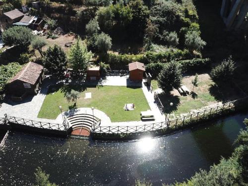 an aerial view of a park next to a river at Casa Nelito in Pedrógão Grande