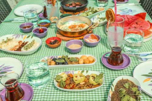 a table topped with plates of food on a table at Kandybos Eco Farm Village in Kas