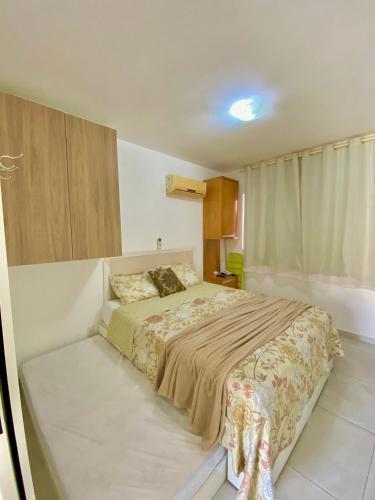 Katil atau katil-katil dalam bilik di Solar Água Apartaments