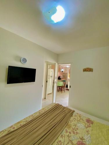 Televisyen dan/atau pusat hiburan di Solar Água Apartaments