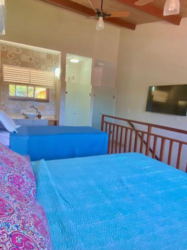 Katil atau katil-katil dalam bilik di Solar Água Apartaments