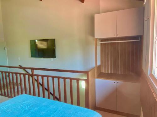 Ένα ή περισσότερα κρεβάτια σε δωμάτιο στο Solar Água Apartaments