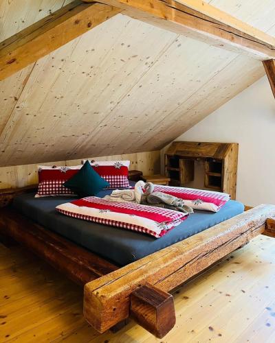a bed in the attic of a room at Conny's B&B in Niederweningen