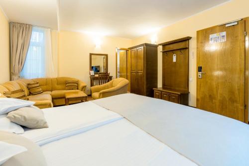 Ein Bett oder Betten in einem Zimmer der Unterkunft Hotel Ambient
