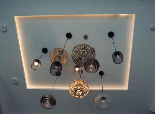 a group of chandeliers hanging from a ceiling at Komfortables Penthouse 200 qm in Langen