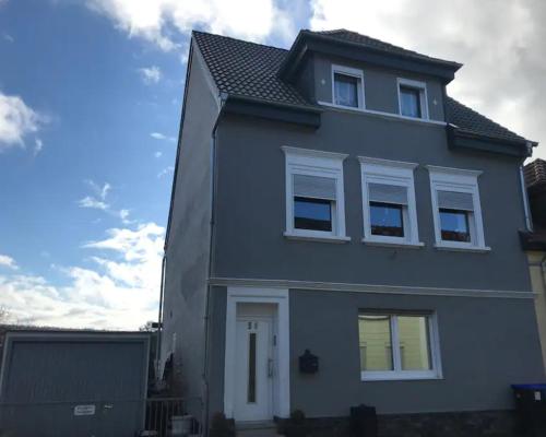 a gray house with white windows on top of it at **** 4 Sterne Apartment 55 qm Saarbrücken Uni Nähe in Saarbrücken