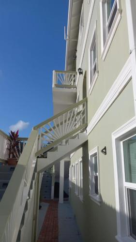 a stairway leading to a building with a balcony at La Pelle in Soufrière
