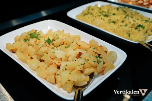 a plate of food with pasta on a table at Vertikalen in Lillesand