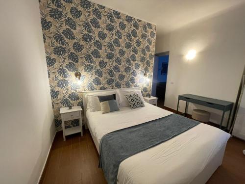 Charming Canonica Apartments tesisinde bir odada yatak veya yataklar