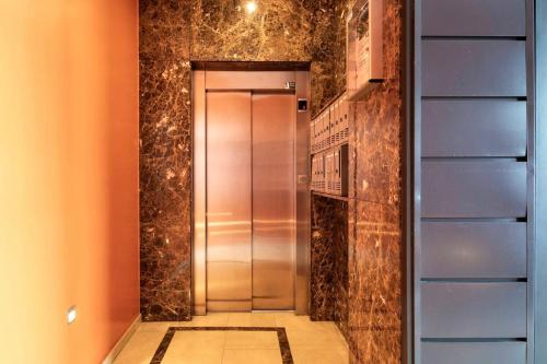 a elevator in a building with a tile floor at One bedroom appartement with wifi at Baiona in Baiona