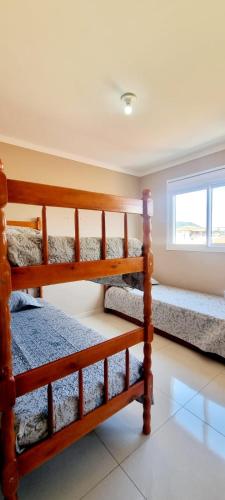 Postel nebo postele na pokoji v ubytování Apto na praia dos ingleses