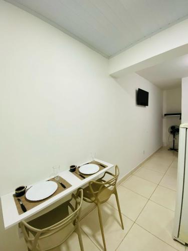 a bathroom with two sinks in a white room at DuPai 10 Sorocaba in Sorocaba