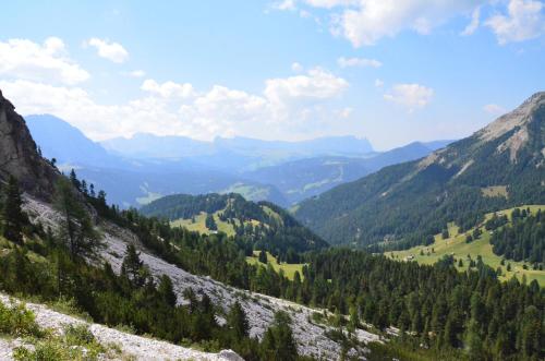 a view of a valley from a mountain at Hotel Chalet Dlaces in Selva di Val Gardena