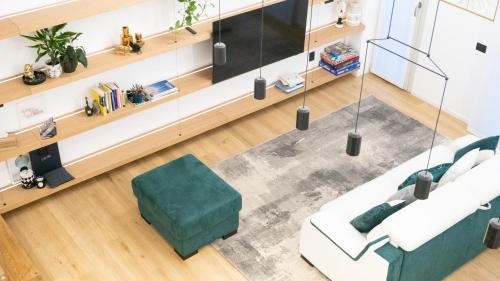 an overhead view of a living room with a couch and chair at Loft Milano Manifatture2 in Milan