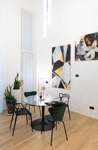 a dining room with a table and chairs at Loft Milano Manifatture2 in Milan
