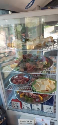 a refrigerator filled with lots of different types of food at Röhrencamp Schöten/Apolda in Apolda