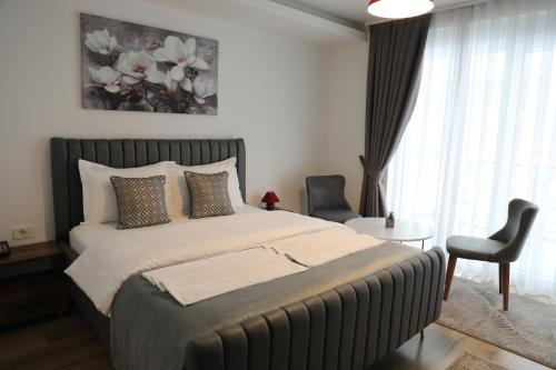 En eller flere senge i et værelse på Andoena Resort