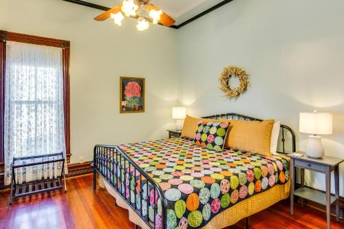 a bedroom with a bed and a window at Granbury Home with Fire Pit, Walk to The Square! in Granbury
