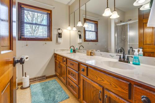 a bathroom with a large sink and a mirror at Spacious Ohio Home about 12 Mi to Downtown Columbus in Worthington