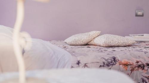 a bed with two pillows on top of it at Bed and Breakfast Torre Polidori in Orvieto