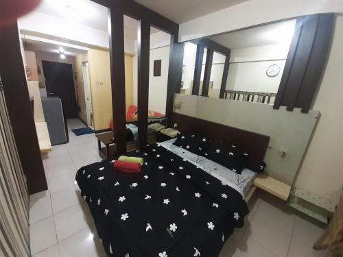Ένα ή περισσότερα κρεβάτια σε δωμάτιο στο Apartemen Suhat Ely Penthouse