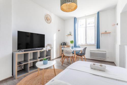 a living room with a large flat screen tv at Cosy apartment in the heart of Marseille - Welkeys in Marseille