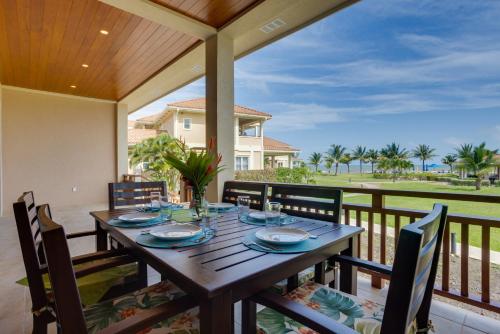 a dining table on a porch with a view of the ocean at Seiri del Mar in Hopkins
