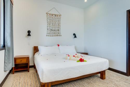 a bedroom with a bed with candles on it at Seiri del Mar in Hopkins