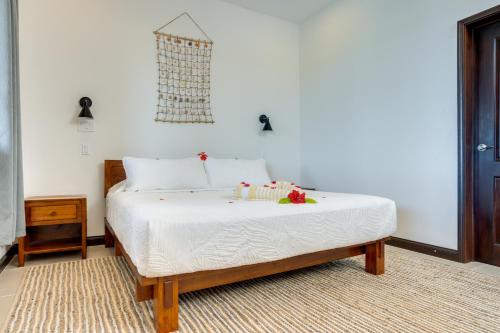 a bedroom with a bed with candles on it at Seiri del Mar in Hopkins