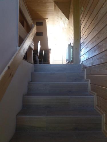 a set of stairs leading up to a house at Agroturystyka Leśna Malinka in Celejów