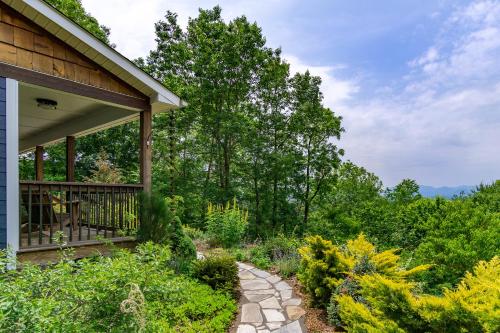 a porch of a house with a walkway at Mountain Over Main Street 5 Min. to Downtown Weaverville, Fire Pit & Views! in Weaverville