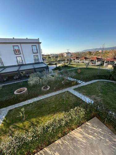 an aerial view of a yard with a building at Evergreen Laguna Vain-Lezhe in Lezhë