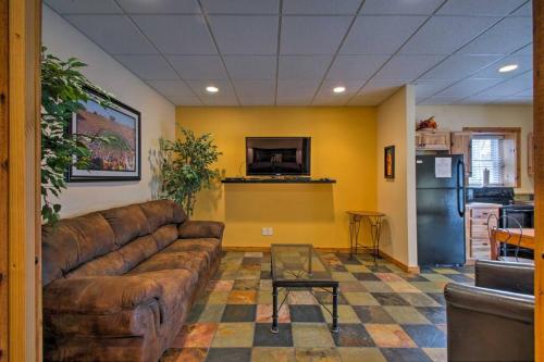 a living room with a brown couch and a kitchen at Appalachian House Downtown Boone ON King Street in Boone