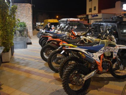 a row of motorcycles parked next to each other at Hotel Golden Sunset Dakhla in Dakhla