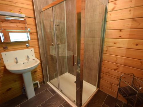 a bathroom with a shower and a sink at 2 Bed in Dulverton WONHA in Bampton