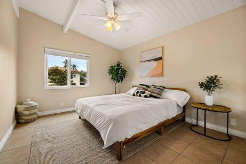 a bedroom with a bed and a ceiling fan at American Riviera Oasis Close to Beach and Downtown in Santa Barbara