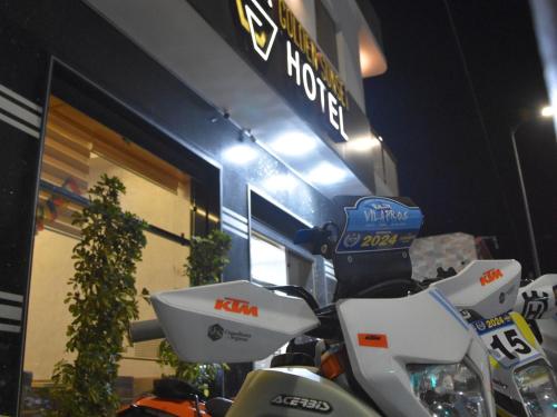 a group of motorcycles parked in front of a store at Hotel Golden Sunset Dakhla in Dakhla