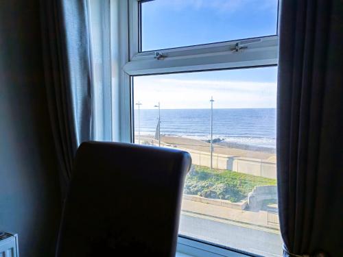 a window with a view of the ocean at Seahawk Holiday Apartments in Cleveleys