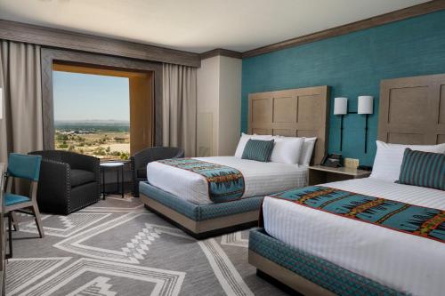 a hotel room with two beds and a window at Sandia Resort and Casino in Albuquerque