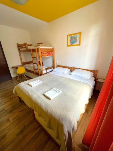 a bedroom with a large bed in a room at Jardim Botânico House in Curitiba