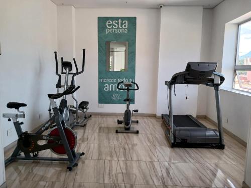 a gym with several exercise bikes in a room at Hotel Sixtina Plaza Medellin in Medellín