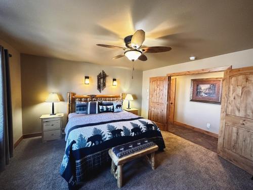a bedroom with a bed and a ceiling fan at Pine Ridge Paradise in Red Lodge