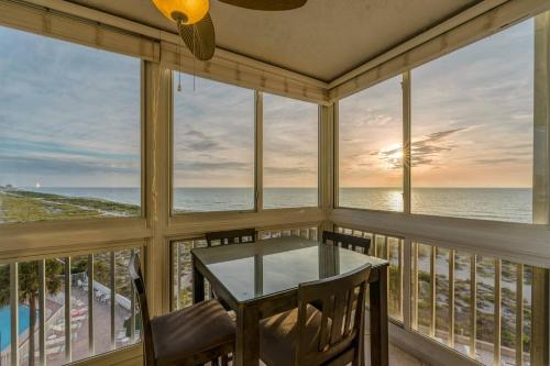 a dining room with a view of the ocean at San Marco 5th Floor with Private Beach in Venice