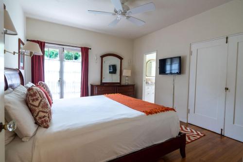 a bedroom with a bed and a ceiling fan at La Jolla Shores Oceanview Retreat in San Diego