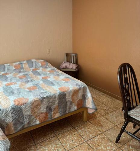 Departamento La Comarca 2 tesisinde bir odada yatak veya yataklar