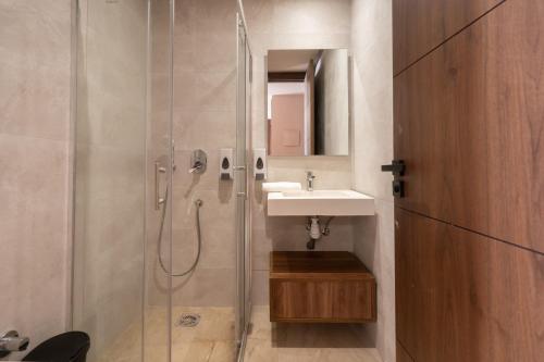 a bathroom with a shower and a sink at Luxoria by SHORTSTAYCASA- New & Chic in the heart of town in Casablanca