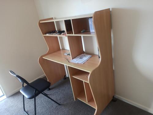 an office with a desk and a chair at 10 Tapuwae in Auckland