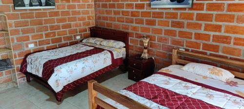 Postelja oz. postelje v sobi nastanitve Hostería La Tolita de John 8 Pax